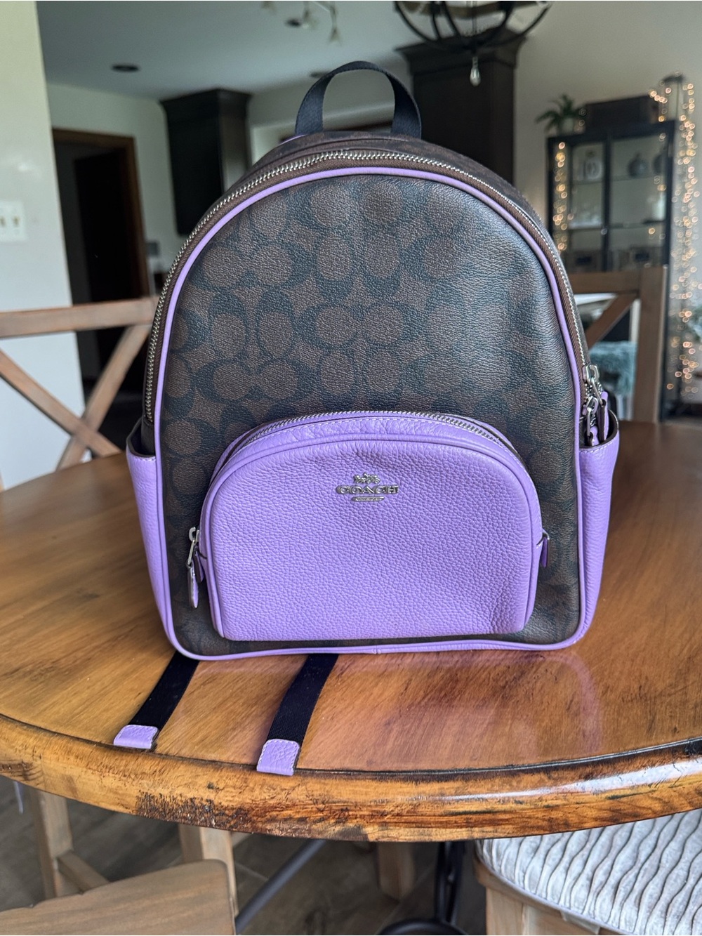 Like new Coach signature and purple medium sized backpack